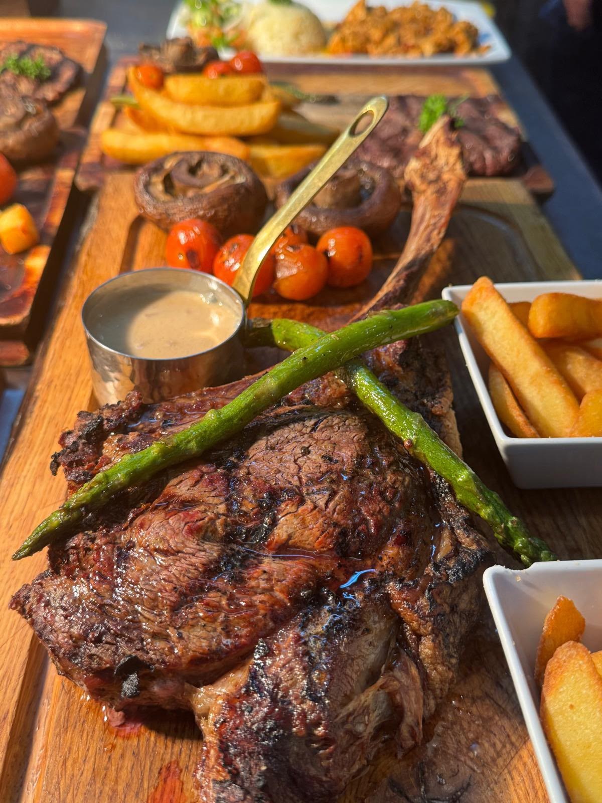 Tomahawk steak with sides